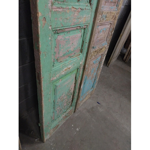 551 - Pair of 19th C. distressed pine doors with raised panels {241 cm H x 50 cm W x 5 cm D}.