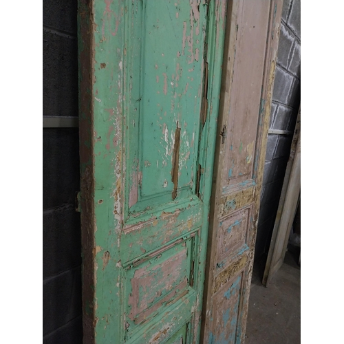 551 - Pair of 19th C. distressed pine doors with raised panels {241 cm H x 50 cm W x 5 cm D}.