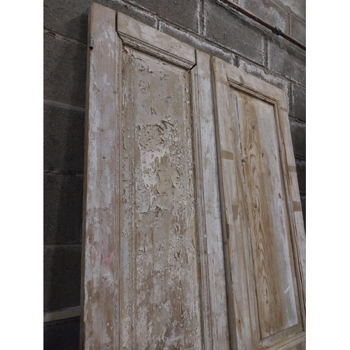 561 - Pair of 19th C. distressed pine panelled doors {240 cm H x 50 cm W x 6 cm D}.