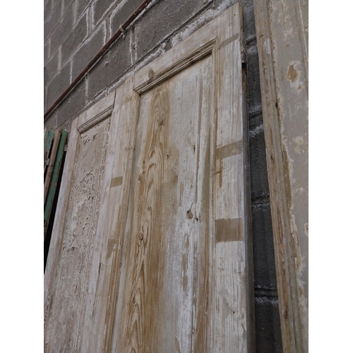 561 - Pair of 19th C. distressed pine panelled doors {240 cm H x 50 cm W x 6 cm D}.