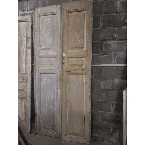 562 - Pair of 19th C. distressed pine panelled doors {252 cm H x 55 cm W x 6 cm D}.