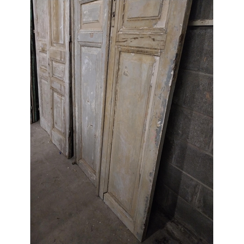 562 - Pair of 19th C. distressed pine panelled doors {252 cm H x 55 cm W x 6 cm D}.