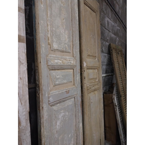 562 - Pair of 19th C. distressed pine panelled doors {252 cm H x 55 cm W x 6 cm D}.