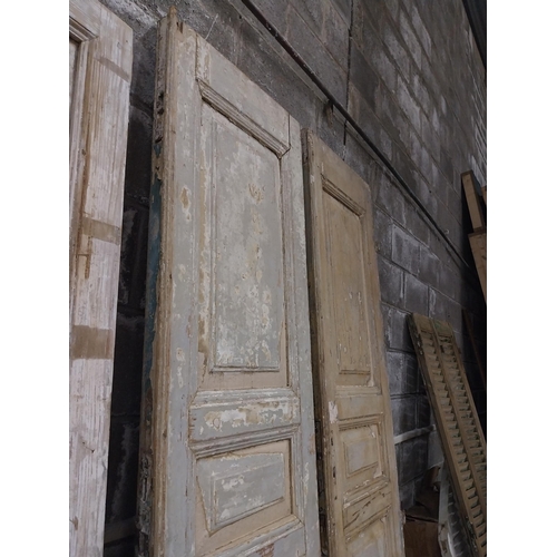 562 - Pair of 19th C. distressed pine panelled doors {252 cm H x 55 cm W x 6 cm D}.