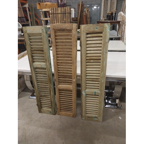 565 - Set of three 19th C. distressed pine Louvre window shutters {136 cm H x 35 cm W x 5 cm D}.