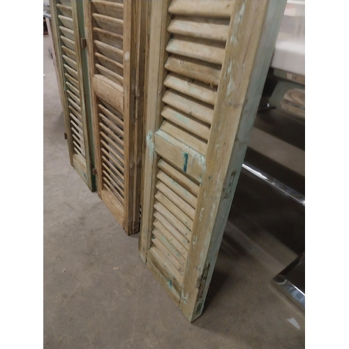 565 - Set of three 19th C. distressed pine Louvre window shutters {136 cm H x 35 cm W x 5 cm D}.