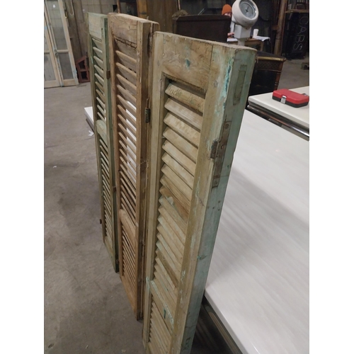 565 - Set of three 19th C. distressed pine Louvre window shutters {136 cm H x 35 cm W x 5 cm D}.