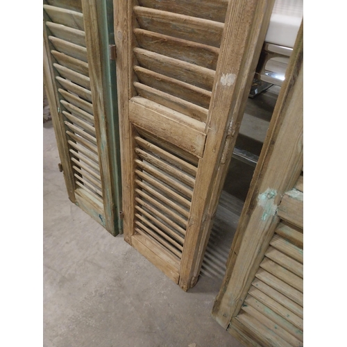 565 - Set of three 19th C. distressed pine Louvre window shutters {136 cm H x 35 cm W x 5 cm D}.