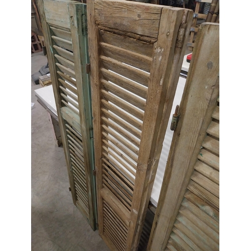 565 - Set of three 19th C. distressed pine Louvre window shutters {136 cm H x 35 cm W x 5 cm D}.