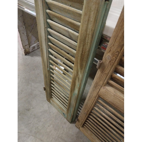 565 - Set of three 19th C. distressed pine Louvre window shutters {136 cm H x 35 cm W x 5 cm D}.