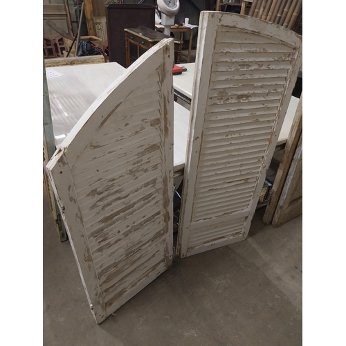 566 - Two 19th C. distressed pine Louvre window shutters {148, 138  cm H x 56, 68  cm W x 5, 5  cm D}.