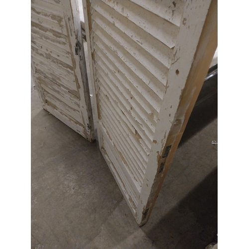 566 - Two 19th C. distressed pine Louvre window shutters {148, 138  cm H x 56, 68  cm W x 5, 5  cm D}.