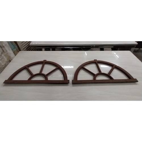 568 - Pair of good quality arched cast iron window frames {37 cm H x 67 cm W x 3 cm D}.