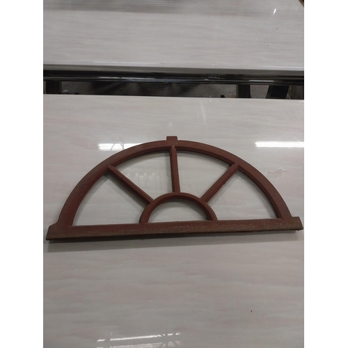 568 - Pair of good quality arched cast iron window frames {37 cm H x 67 cm W x 3 cm D}.