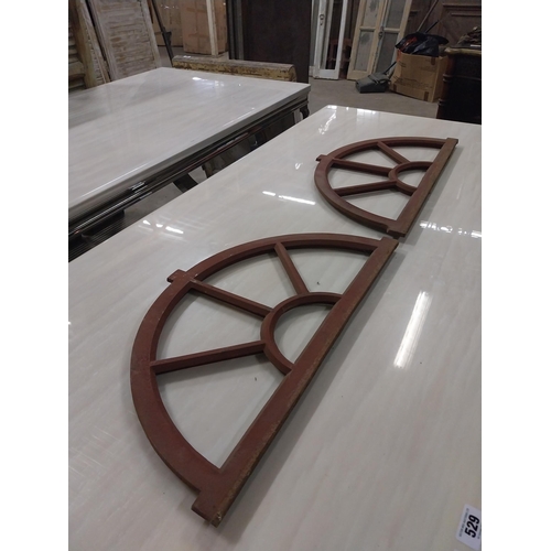 568 - Pair of good quality arched cast iron window frames {37 cm H x 67 cm W x 3 cm D}.