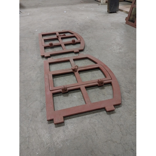 580 - Pair of good quality cast iron window frames with single door {42 cm H x 55 cm W x 4 cm D}.