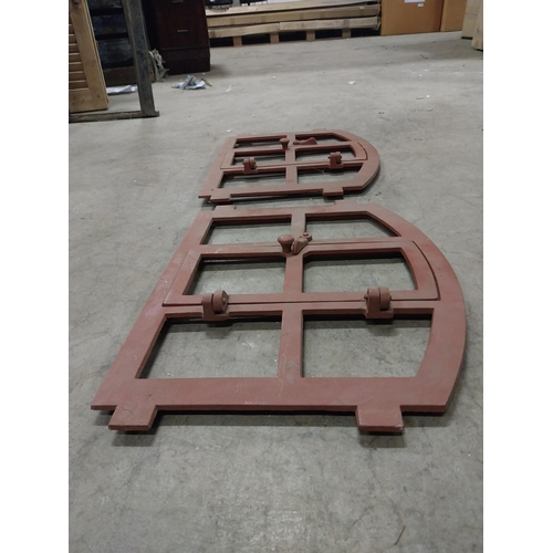 580 - Pair of good quality cast iron window frames with single door {42 cm H x 55 cm W x 4 cm D}.