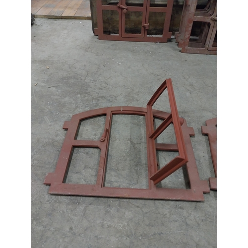 580 - Pair of good quality cast iron window frames with single door {42 cm H x 55 cm W x 4 cm D}.