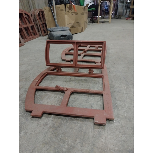 580 - Pair of good quality cast iron window frames with single door {42 cm H x 55 cm W x 4 cm D}.