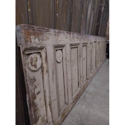 591 - 19th C. pitched pine panelled bar front {77 cm H x 356 cm W x 5 cm D}.