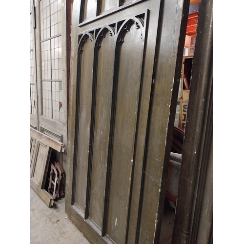 597 - Film prop timber door in the Gothic style {Approx. 330 cm H x 123 cm W x 10 cm D}.