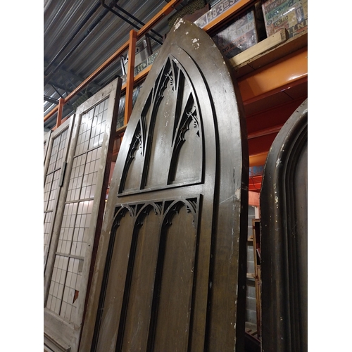 597 - Film prop timber door in the Gothic style {Approx. 330 cm H x 123 cm W x 10 cm D}.