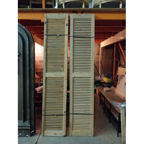 600 - Set of four distressed pine Louvre window shutters{254 cm H x 49 cm W x 5 cm D}.