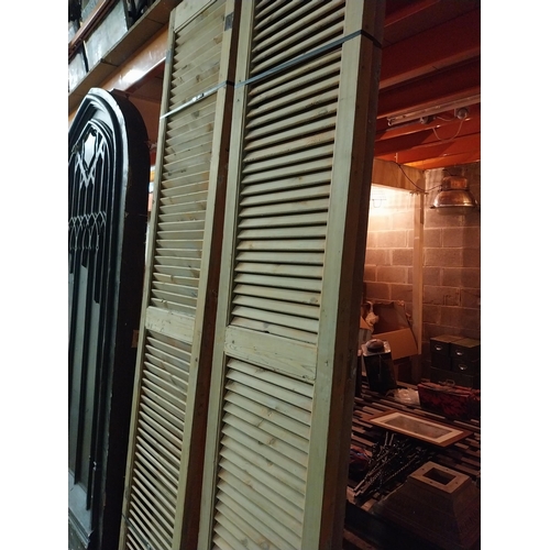 600 - Set of four distressed pine Louvre window shutters{254 cm H x 49 cm W x 5 cm D}.