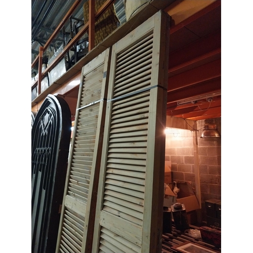 600 - Set of four distressed pine Louvre window shutters{254 cm H x 49 cm W x 5 cm D}.