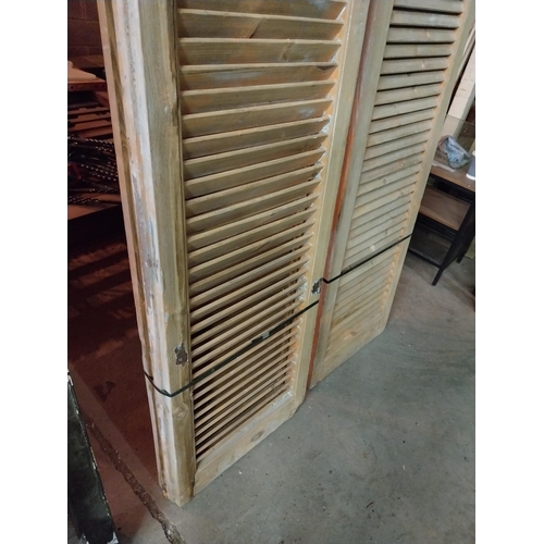 600 - Set of four distressed pine Louvre window shutters{254 cm H x 49 cm W x 5 cm D}.