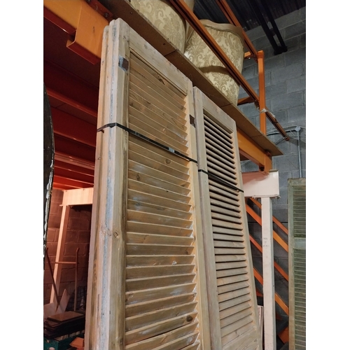 600 - Set of four distressed pine Louvre window shutters{254 cm H x 49 cm W x 5 cm D}.