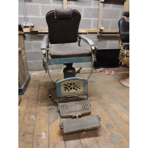 618 - Early 20th C. cast iron and upholstered vinyl barbers chair{105 cm H x 60 cm W x 100 cm D}.