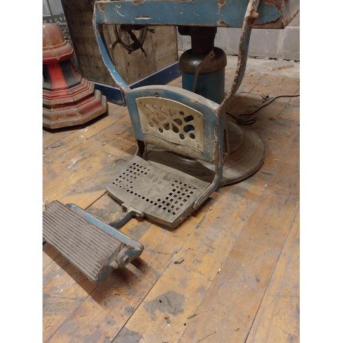 618 - Early 20th C. cast iron and upholstered vinyl barbers chair{105 cm H x 60 cm W x 100 cm D}.