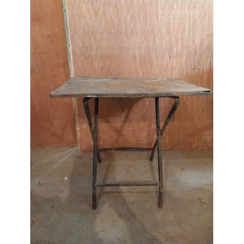 638 - Industrial metal folding table {64 cm H x 67 cm W x 68 cm D}.