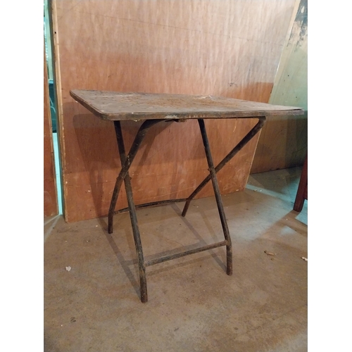 638 - Industrial metal folding table {64 cm H x 67 cm W x 68 cm D}.