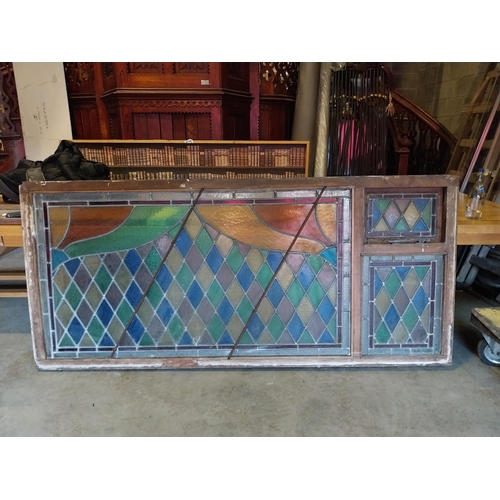 652 - 1950s leaded stain glass window mounted in mahogany frame {100 cm H x 216 cm W x 7 cm D}.