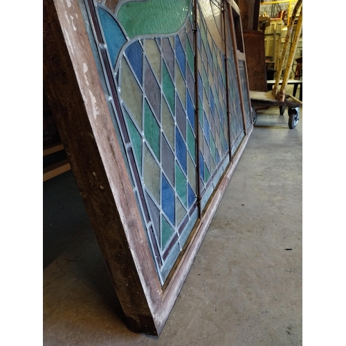 652 - 1950s leaded stain glass window mounted in mahogany frame {100 cm H x 216 cm W x 7 cm D}.