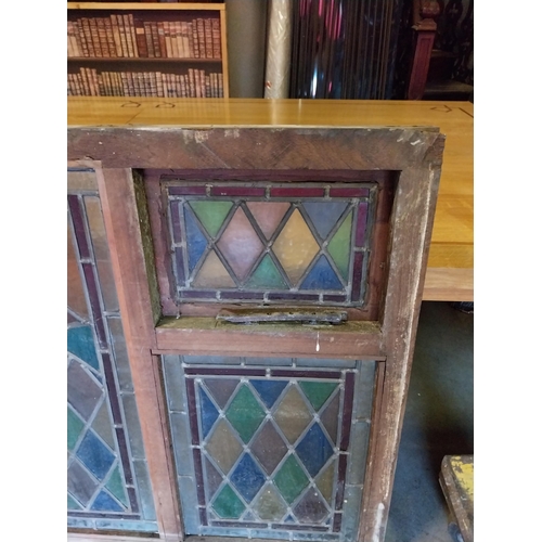 652 - 1950s leaded stain glass window mounted in mahogany frame {100 cm H x 216 cm W x 7 cm D}.