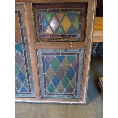 652 - 1950s leaded stain glass window mounted in mahogany frame {100 cm H x 216 cm W x 7 cm D}.