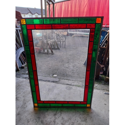 662 - Leaded stained glass window mounted in painted pine frame {130 cm H x 92 cm W x 1 cm D}.