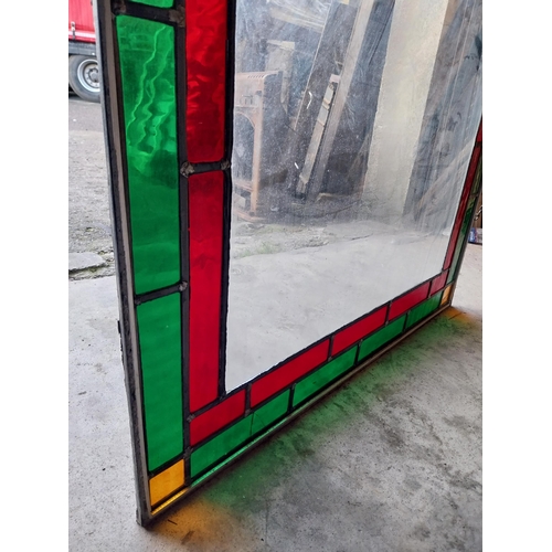 662 - Leaded stained glass window mounted in painted pine frame {130 cm H x 92 cm W x 1 cm D}.