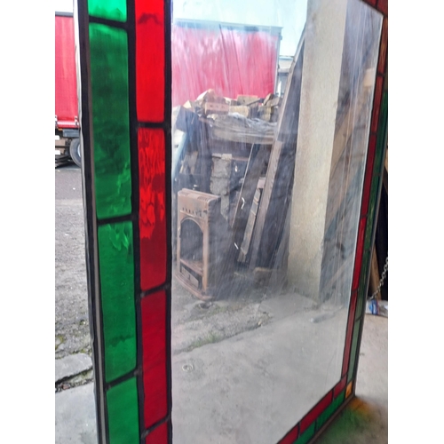 662 - Leaded stained glass window mounted in painted pine frame {130 cm H x 92 cm W x 1 cm D}.