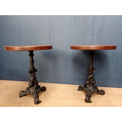 168 - Pair of cast iron dolphin pub table with solid tops {H 73cm x Dia 58cm }.