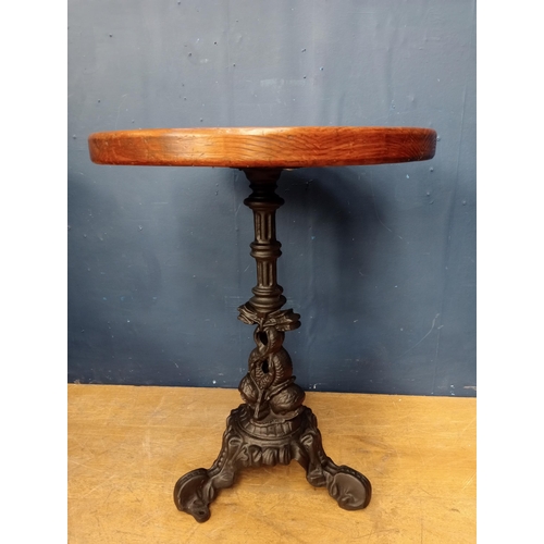 207 - Cast iron dolphin pub table with solid top {H 73cm x Dia 58cm }.