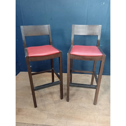 208 - Pair of high stools with red leather upholstered seats {H 100cm x W 40cm x D 40cm }.