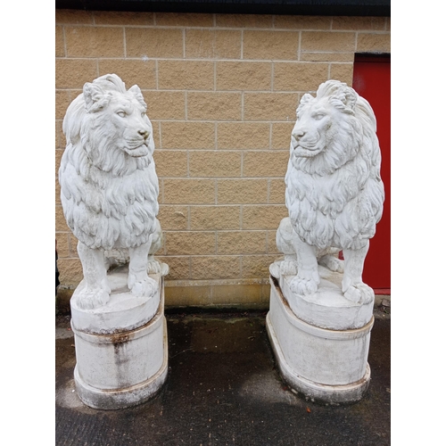 249 - Composition stone lions raised on bases {H 180cm x W 50cm x D 110cm }.