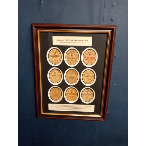 379 - Guinness bottle advertising labels mounted in frame {H 46cm x W 36cm }.