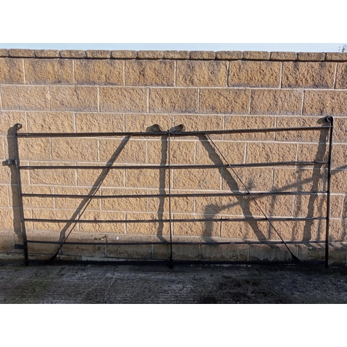 594 - Wrought iron black field gate{H 135cm x W 292cm x D 4cm}.