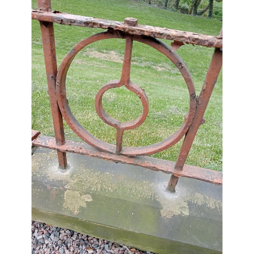 75 - Patio blacksmith wrought iron railings raised on sandstone base {H 56cm x L 630cm x D 23cm}.