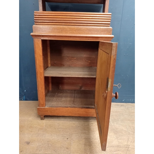 76 - Oak book press over cabinet with single blind door {H 156cm x W 66cm x D 44cm }.